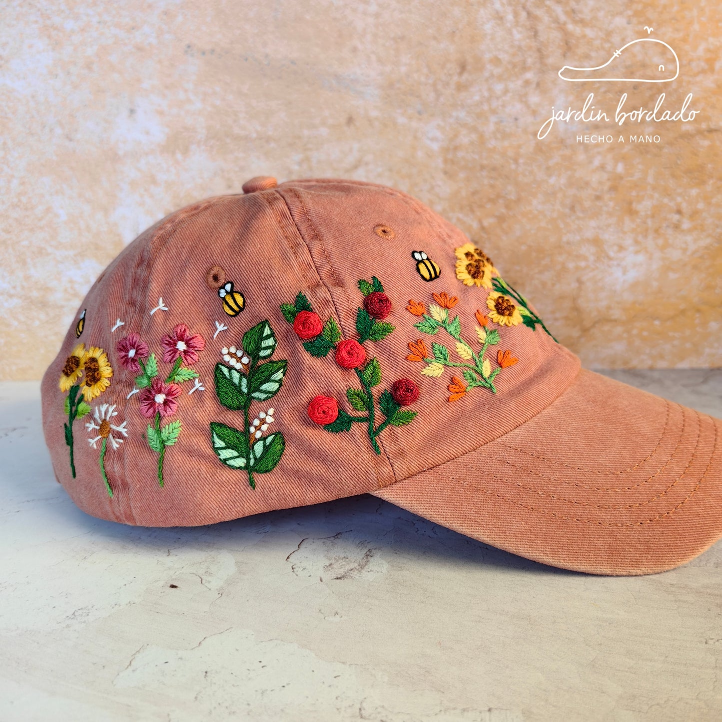 Gorra flores naranja